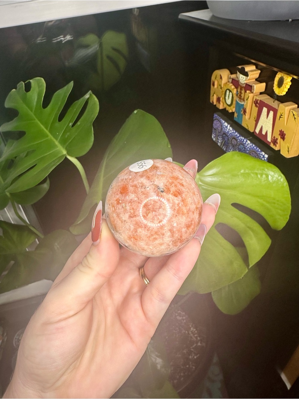 Orange sunstone crystals sphere with banding